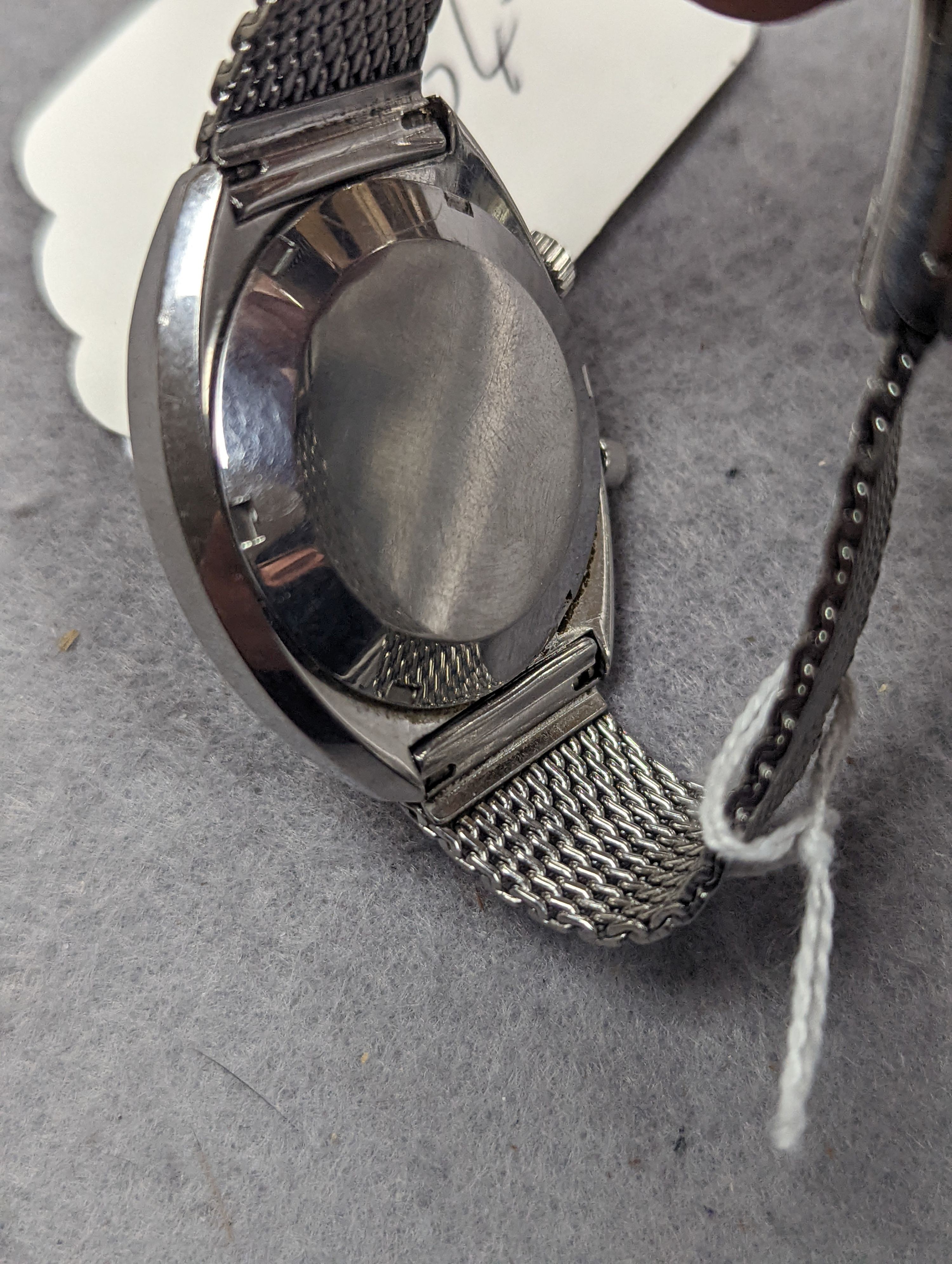 A gentleman's 1970's stainless steel Omega Chronostop manual wind wrist watch, on stainless steel Omega mesh link bracelet, case diameter 35mm, no box or papers.